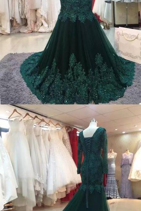 emerald green gown with sleeves